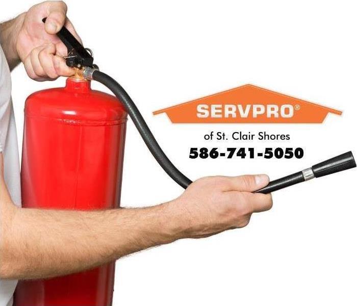 person holding fire extinguisher 