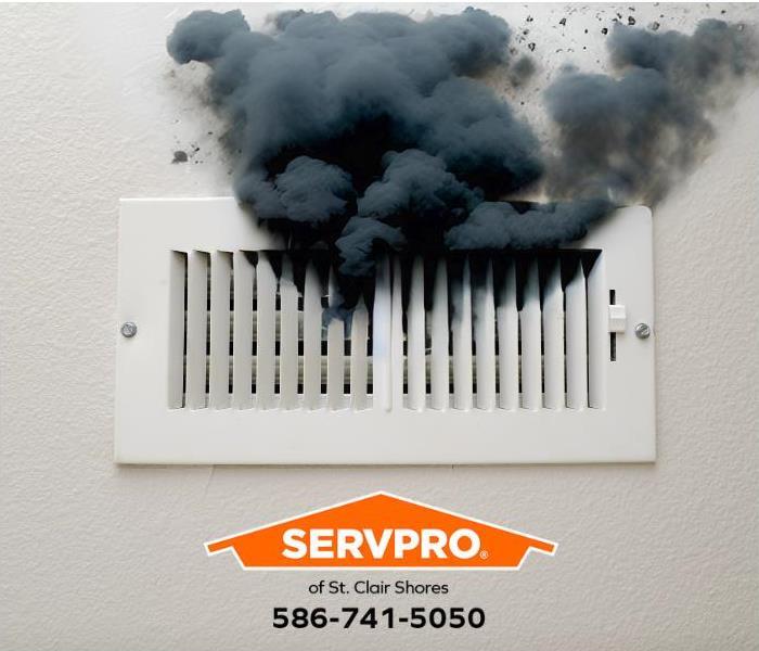 Soot from a puff back escapes through a vent and covers a wall.